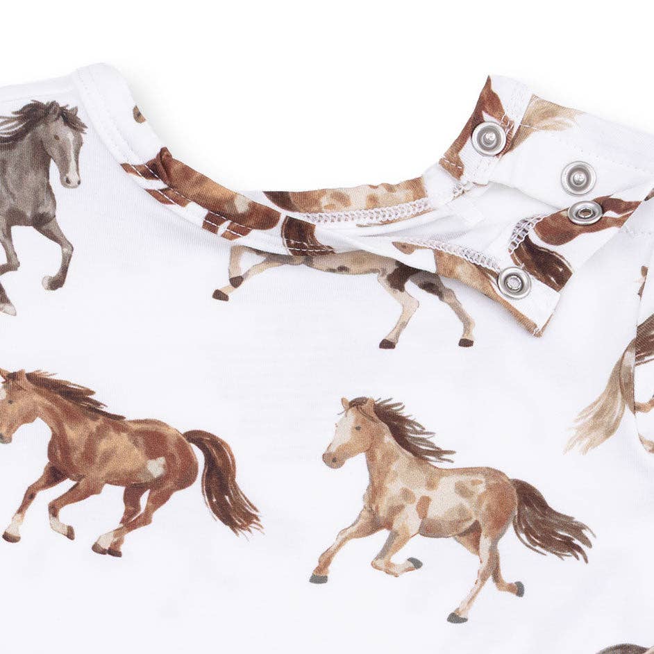 close up of bodysuit with black and brown horse patterned