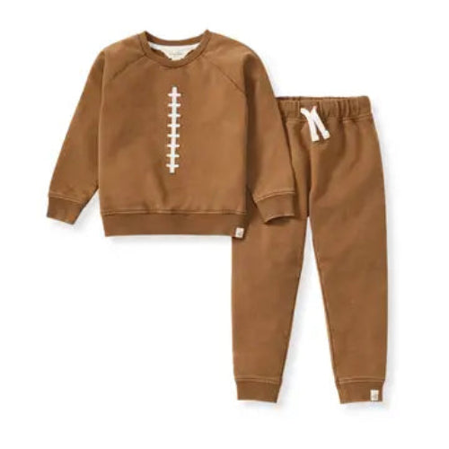 Brown children's sweatshirt that looks like a football and matching pants set on a white background