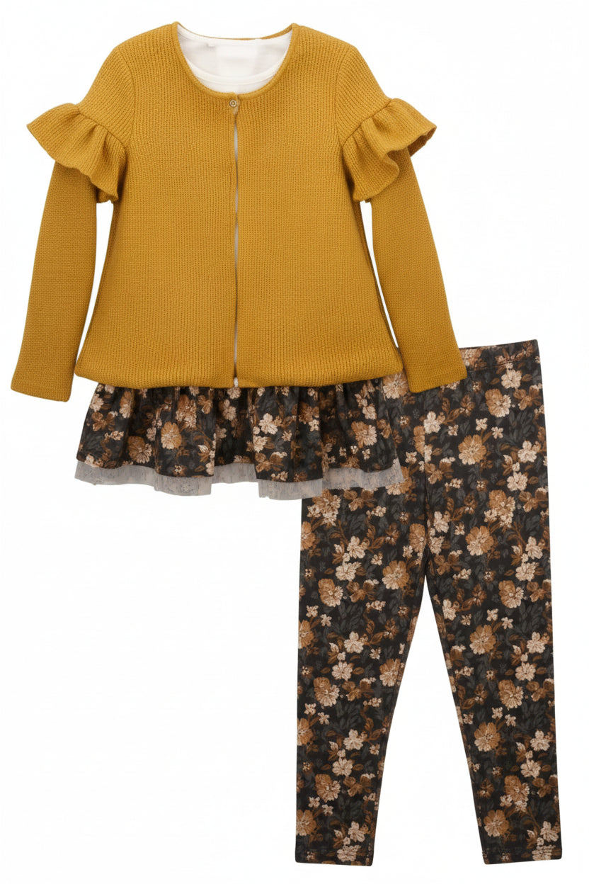 Mustard yellow top and floral leggings set on a plain background
