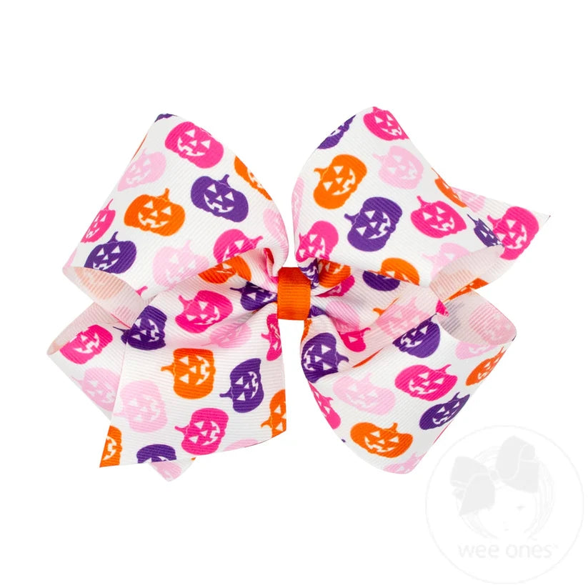 White bow with purple orange and pink jack o lanterns.
