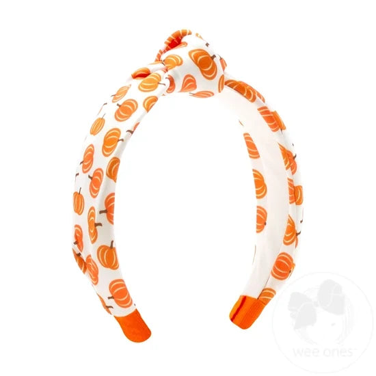 Knot style headband with pumpkin pattern. 