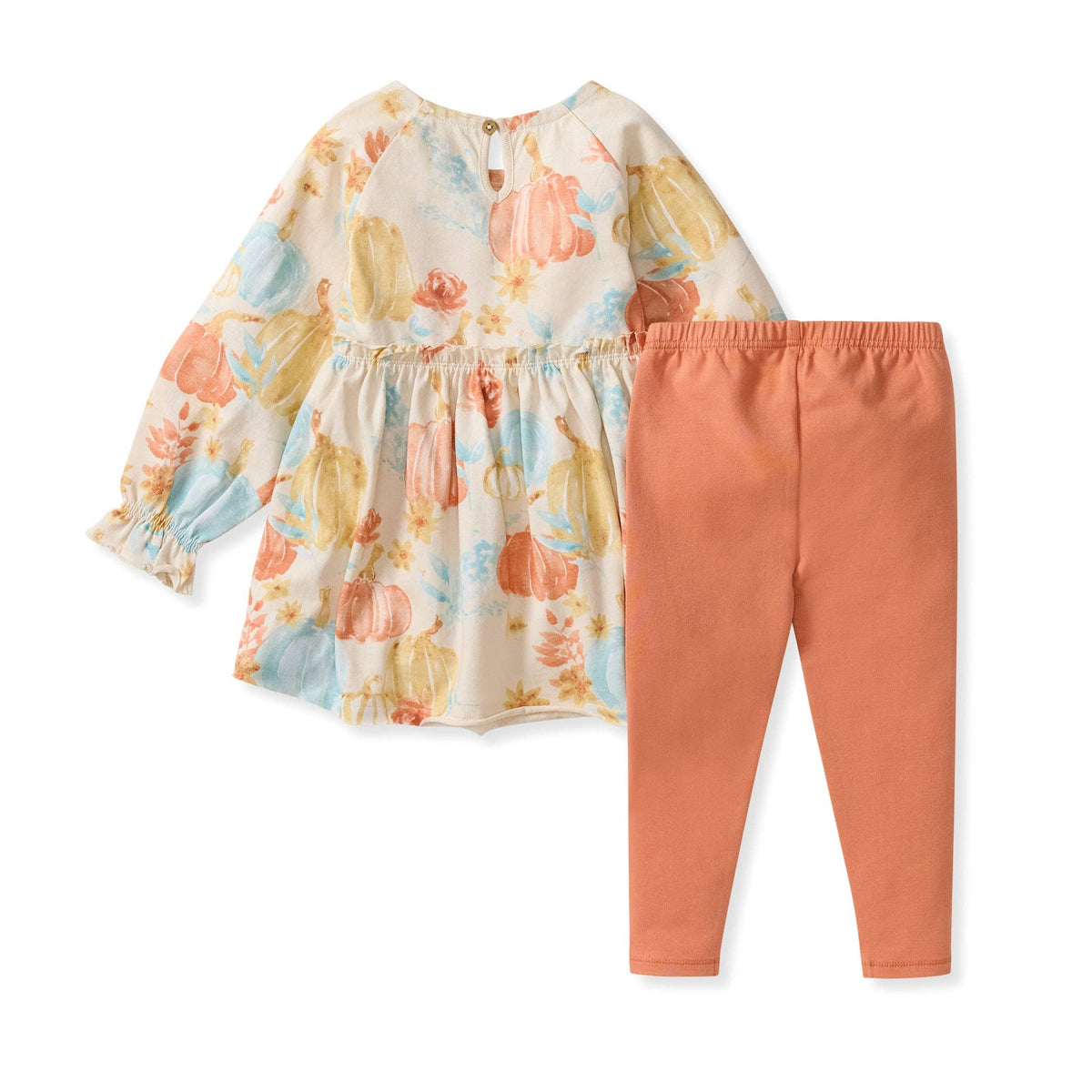 Floral top and peach pants set on a white background