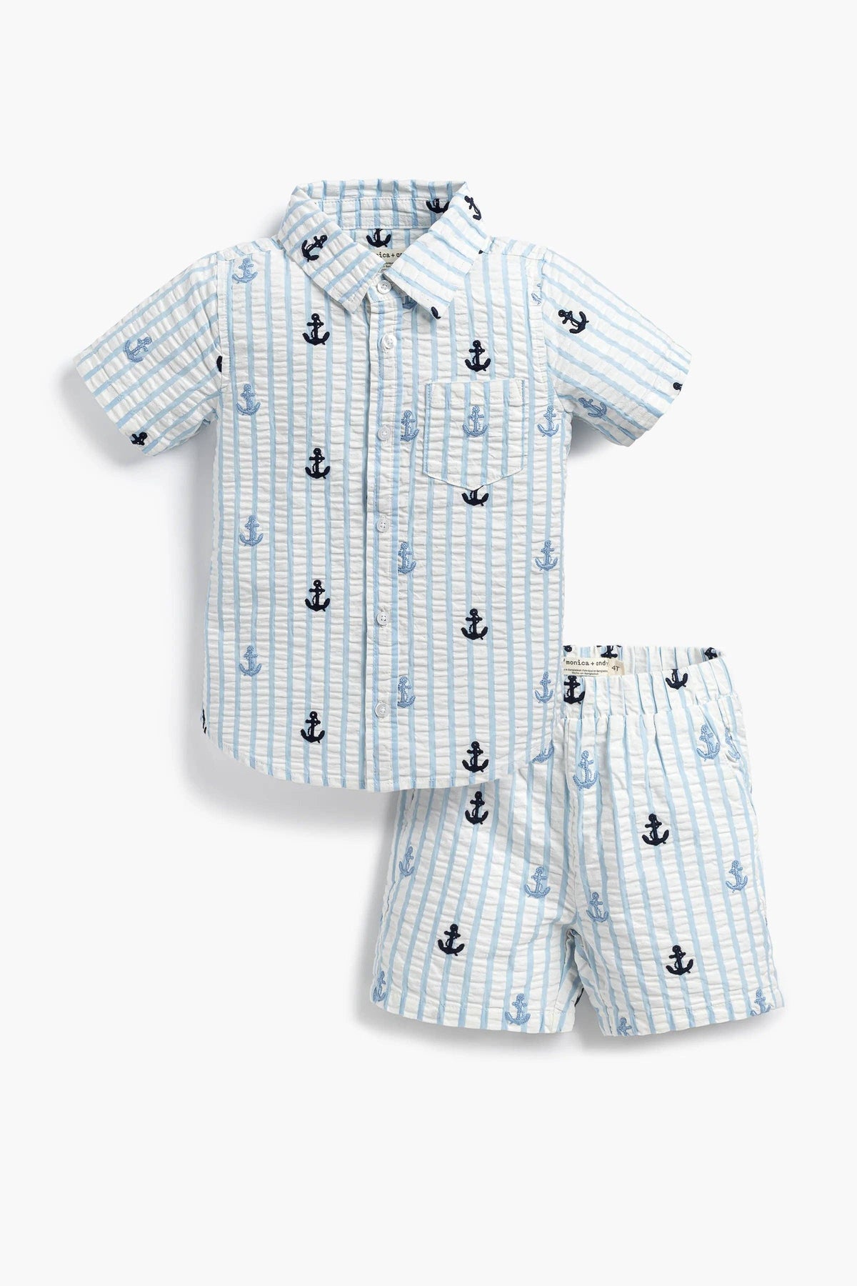 A two-piece boys' short-sleeve shirt and shorts set in a light blue and white striped pattern, decorated with small anchor prints in navy and light blue.