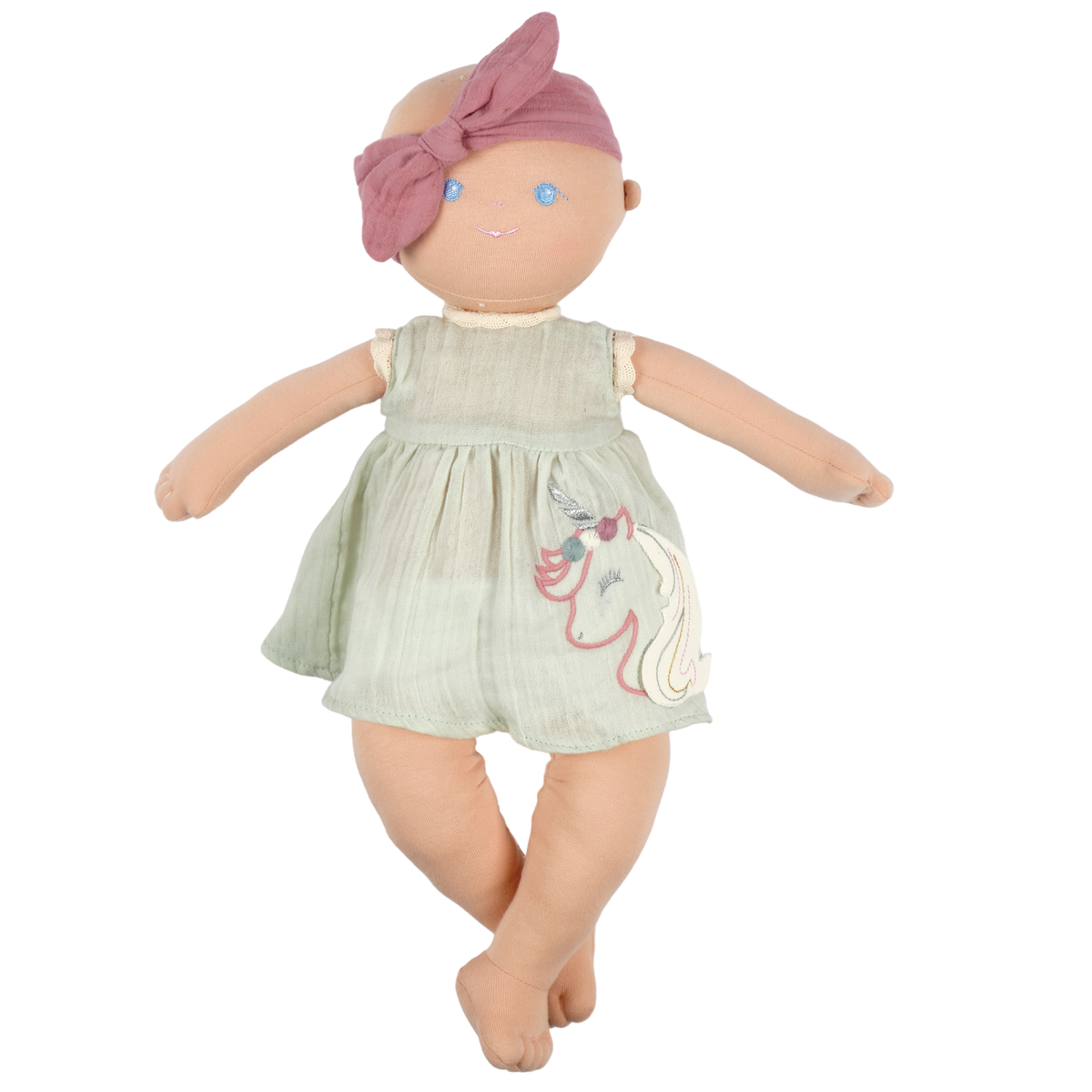 Plush baby doll with embroidered unicorn and a dusty pink headband on a white background. 