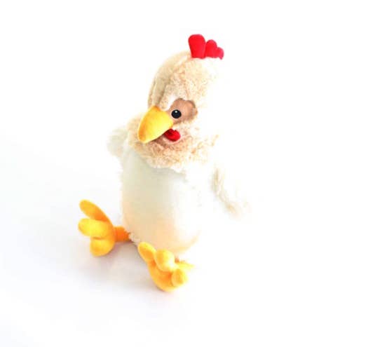 Plush chicken with yellow beak and feet against a white background. 