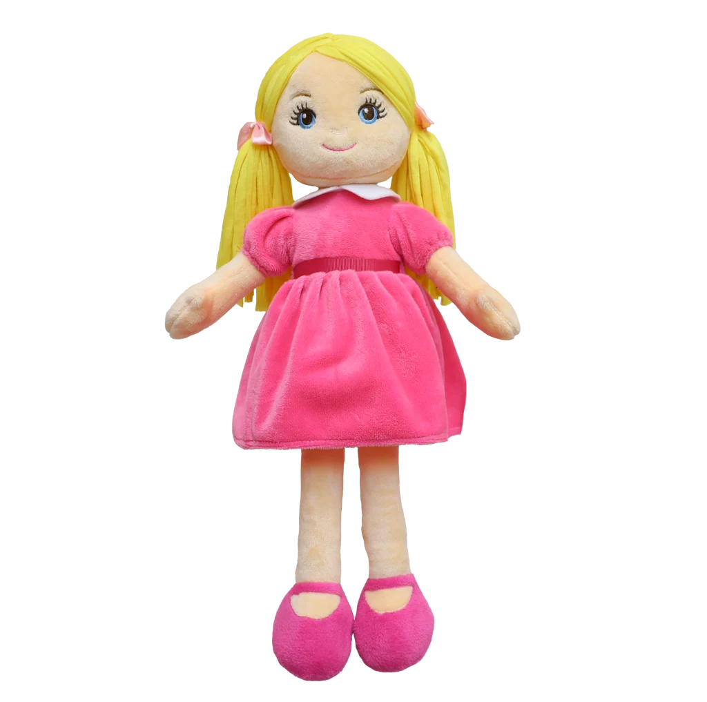 A doll with blonde pigtails and bright blue eyes, dressed in a pink dress with matching pink shoes and bows, sits against a plain white background.