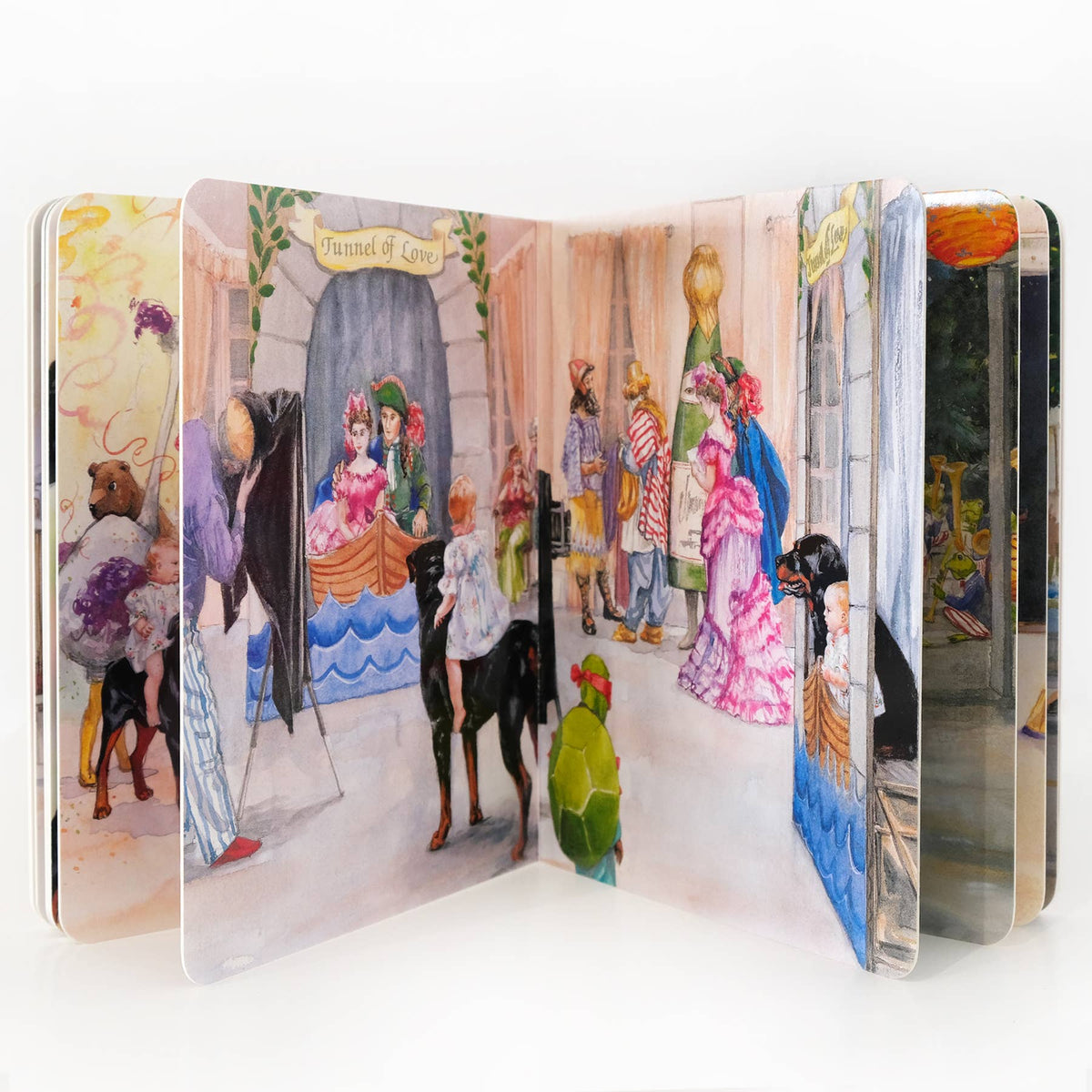 A folding accordion-style book with multiple illustrated panels showing a whimsical street scene. The artwork features people in colorful historical dresses, animals, and architectural details, photographed against a clean white background.