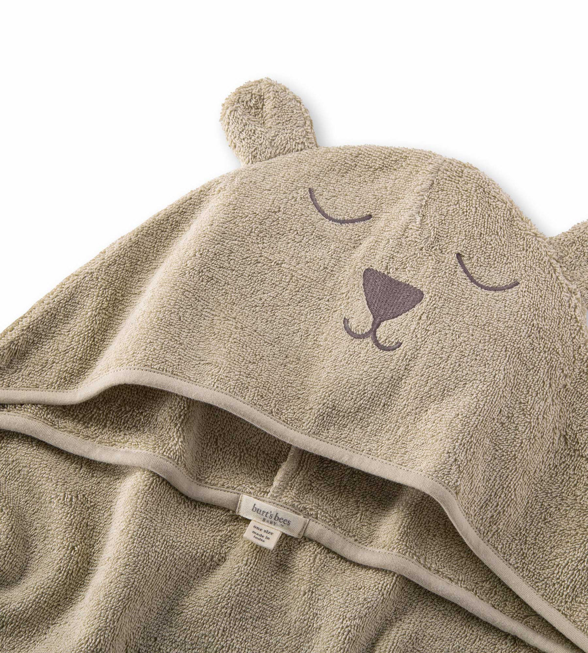  Beige Hooded bear towel with a peaceful expression against a white background. 
