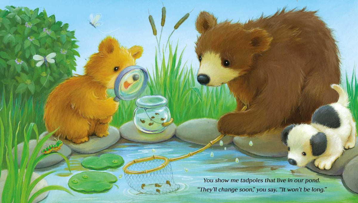 Picture of 2 bears, one big one little, sittting at a pond looking at the fish. 