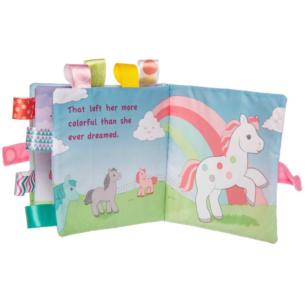 Children's soft book with colorful unicorn illustrations and taggies on a white background