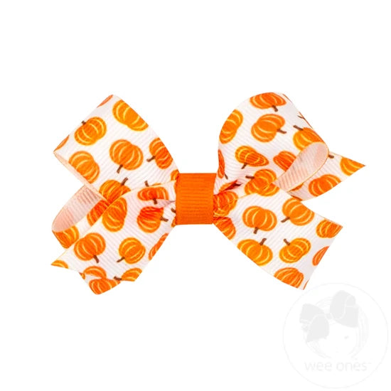 White bow with harvest pumpkin print. 
