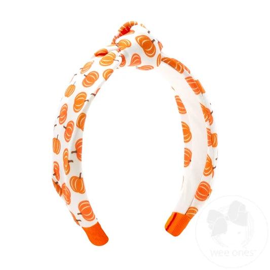 Knot style headband with pumpkin pattern. 